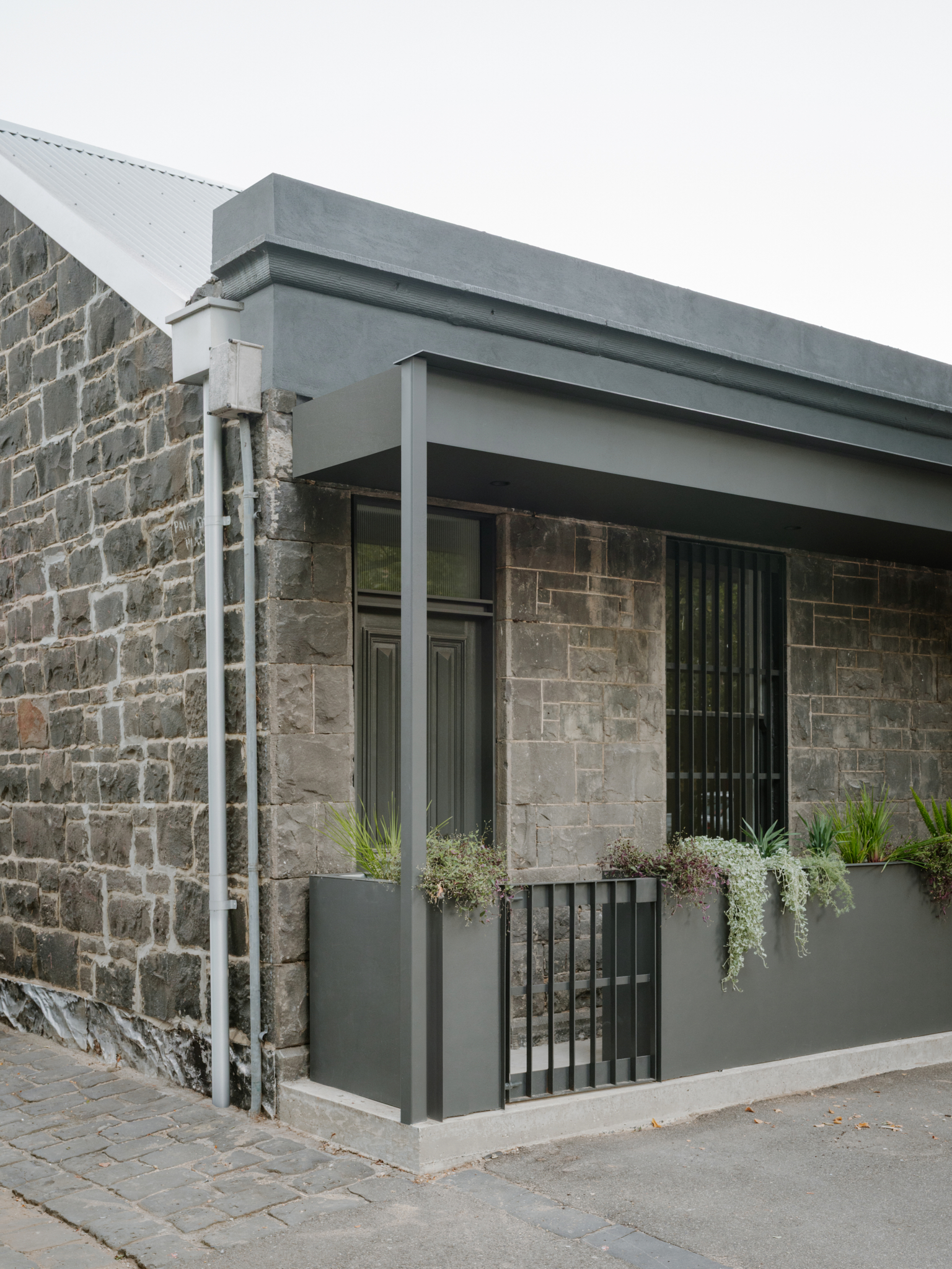 Bluestone House. Ellul Architecture. Carlton. Heritage Bluestone. Planters