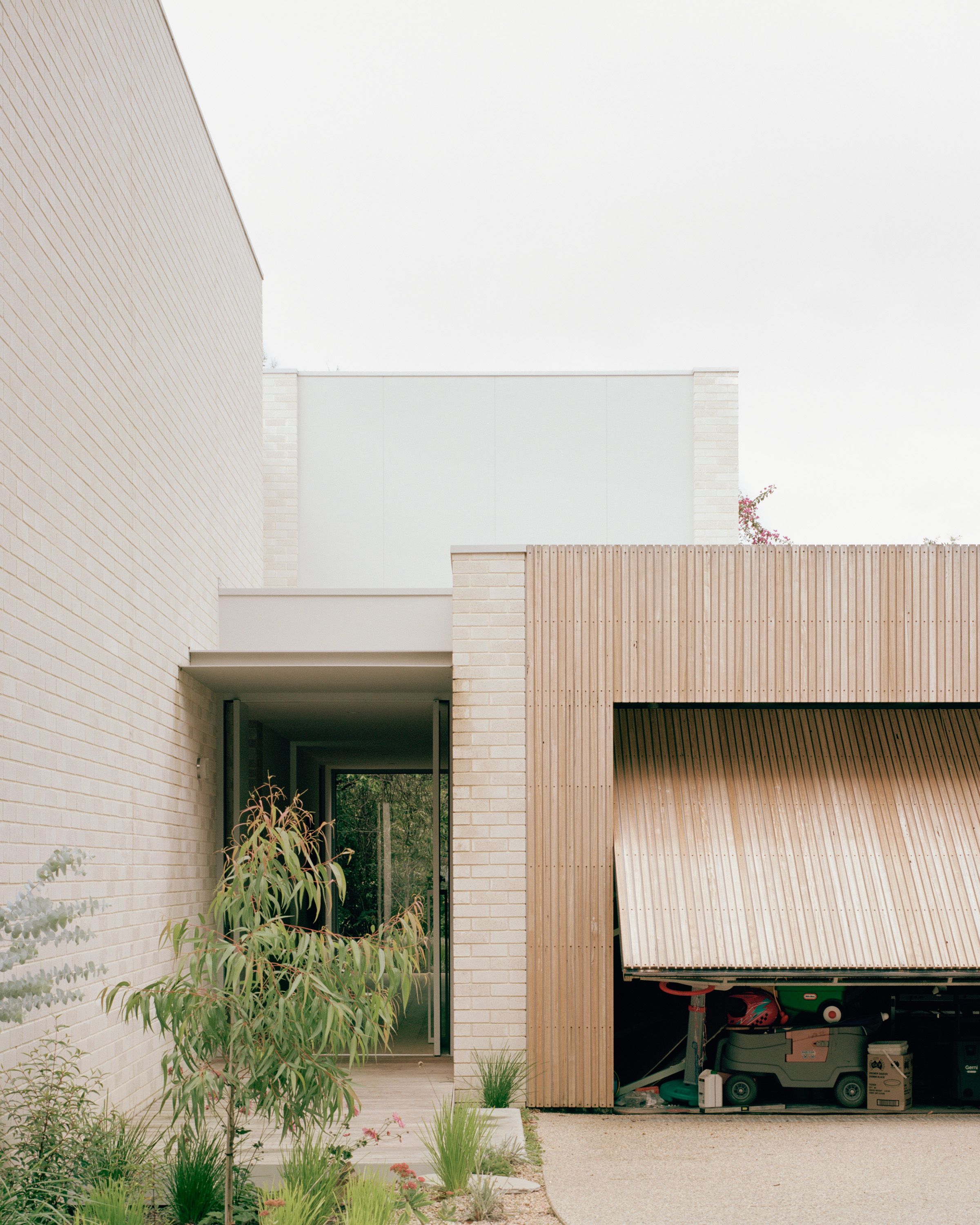 Vasey Pavilions. Ellul Architecture. Entrance. Brick. Blackbutt Battens. Shroud